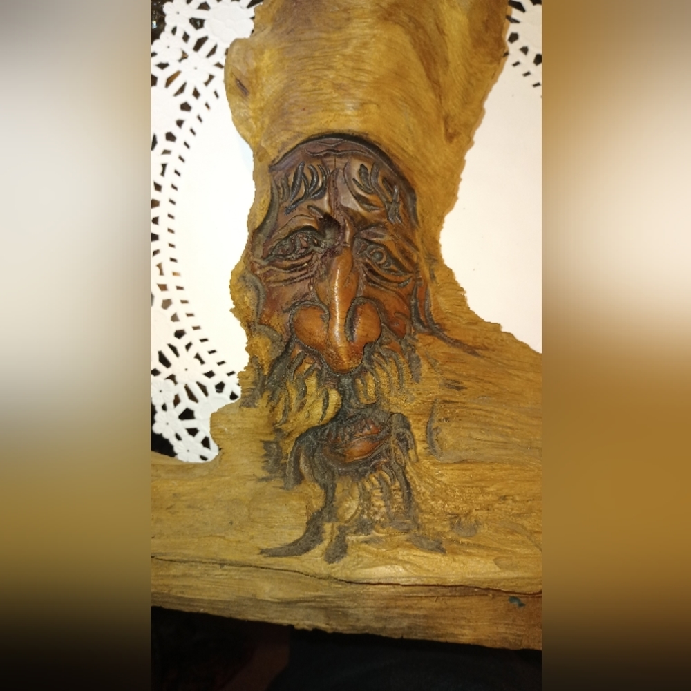 WOOD carving/wizard/man/17x17 in. Hangs on wall.